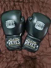 Professional Cleto Reyes hook and loop training and sparring gloves in classic stealth black featuring high-compression padding and the iconic white Cleto Reyes logo at PunchPro Boxing.
