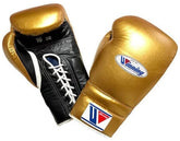 Custom metallic gold and black Winning professional lace-up boxing gloves featuring a 16 oz weight stamp and premium leather finish at PunchPro Boxing.