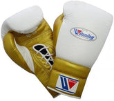 Custom white and metallic gold Winning professional lace-up boxing gloves featuring a 16 oz weight stamp and premium leather finish at PunchPro Boxing.