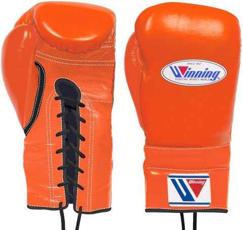 Custom orange and black Winning professional lace-up boxing gloves featuring a premium leather finish and black laces at PunchPro Boxing.