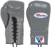Custom grey Winning professional lace-up boxing gloves featuring a premium leather finish and black laces on a white background at PunchPro Boxing.