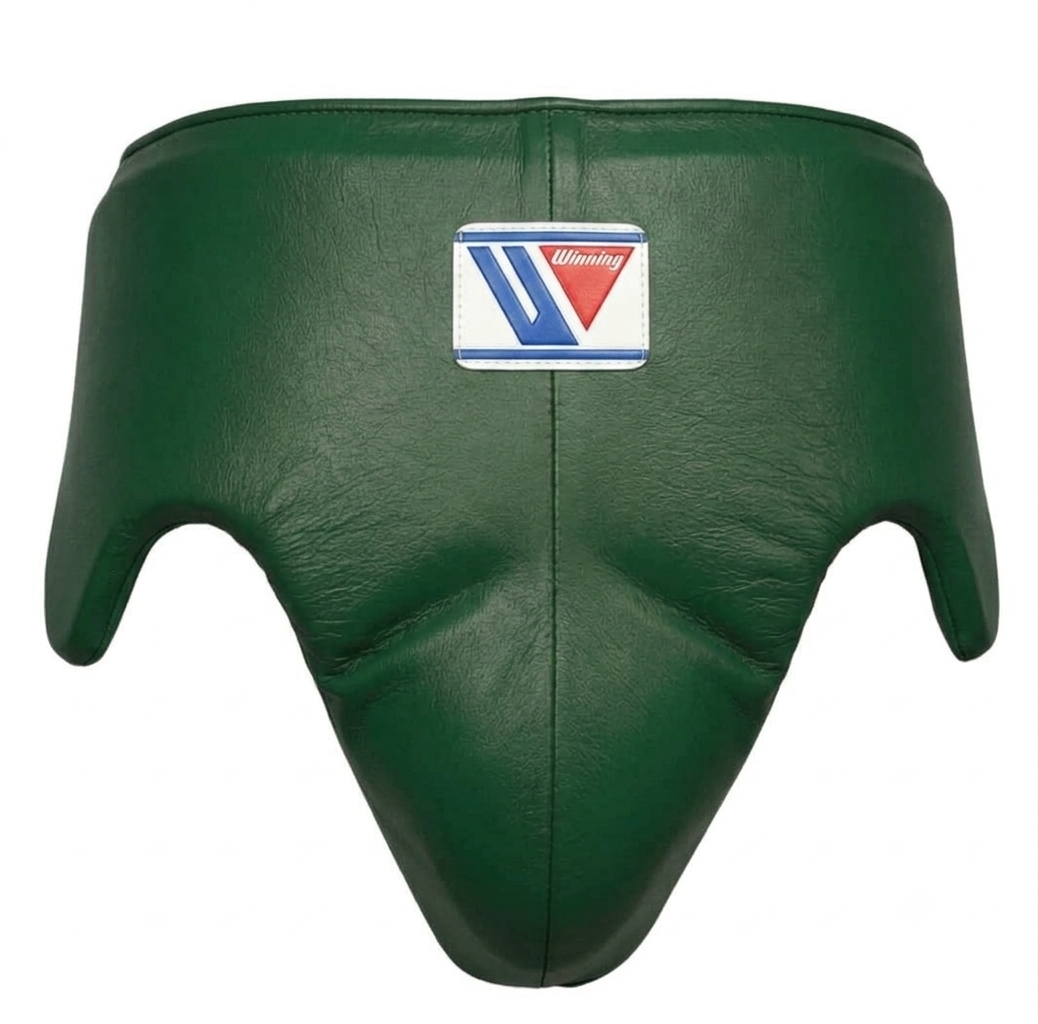 Close-up of the metallic green headgear and brand logo patch