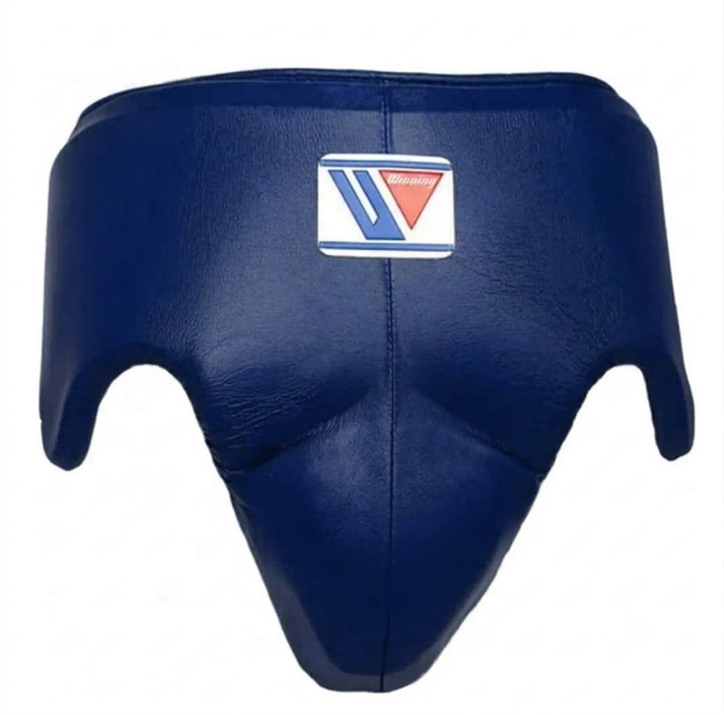 A navy blue leather boxing guard or headgear with a white, blue, and red logo patch on the front, set against a plain white background.