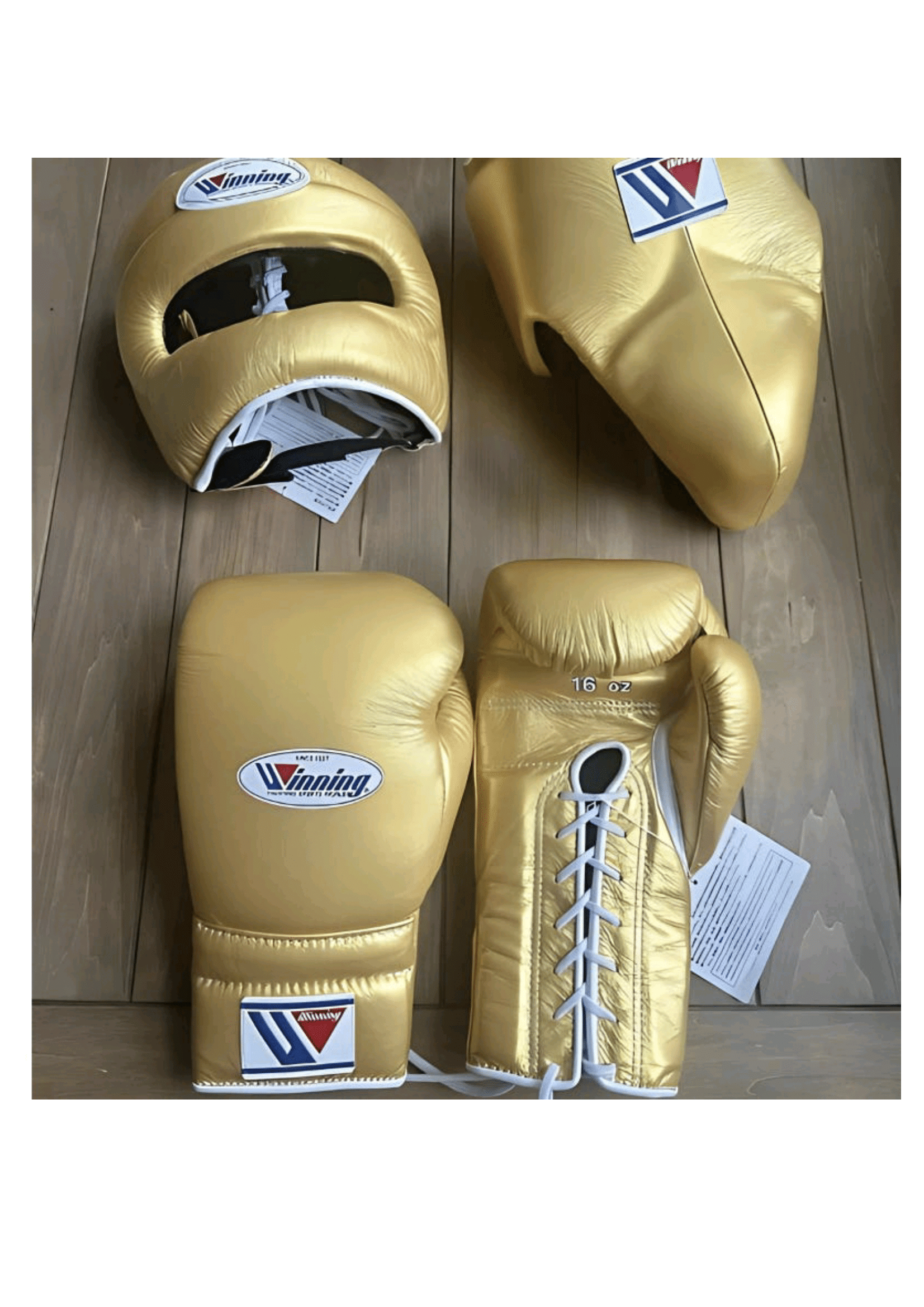 Complete Winning professional custom metallic gold training set including 16 oz lace-up gloves, matching headgear, and groin protector on a wooden background at PunchPro Boxing.