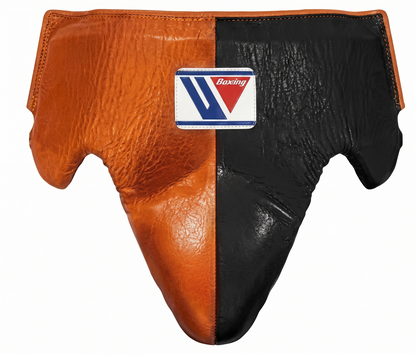 Close-up of the orange and black boxing headgear and brand logo patch