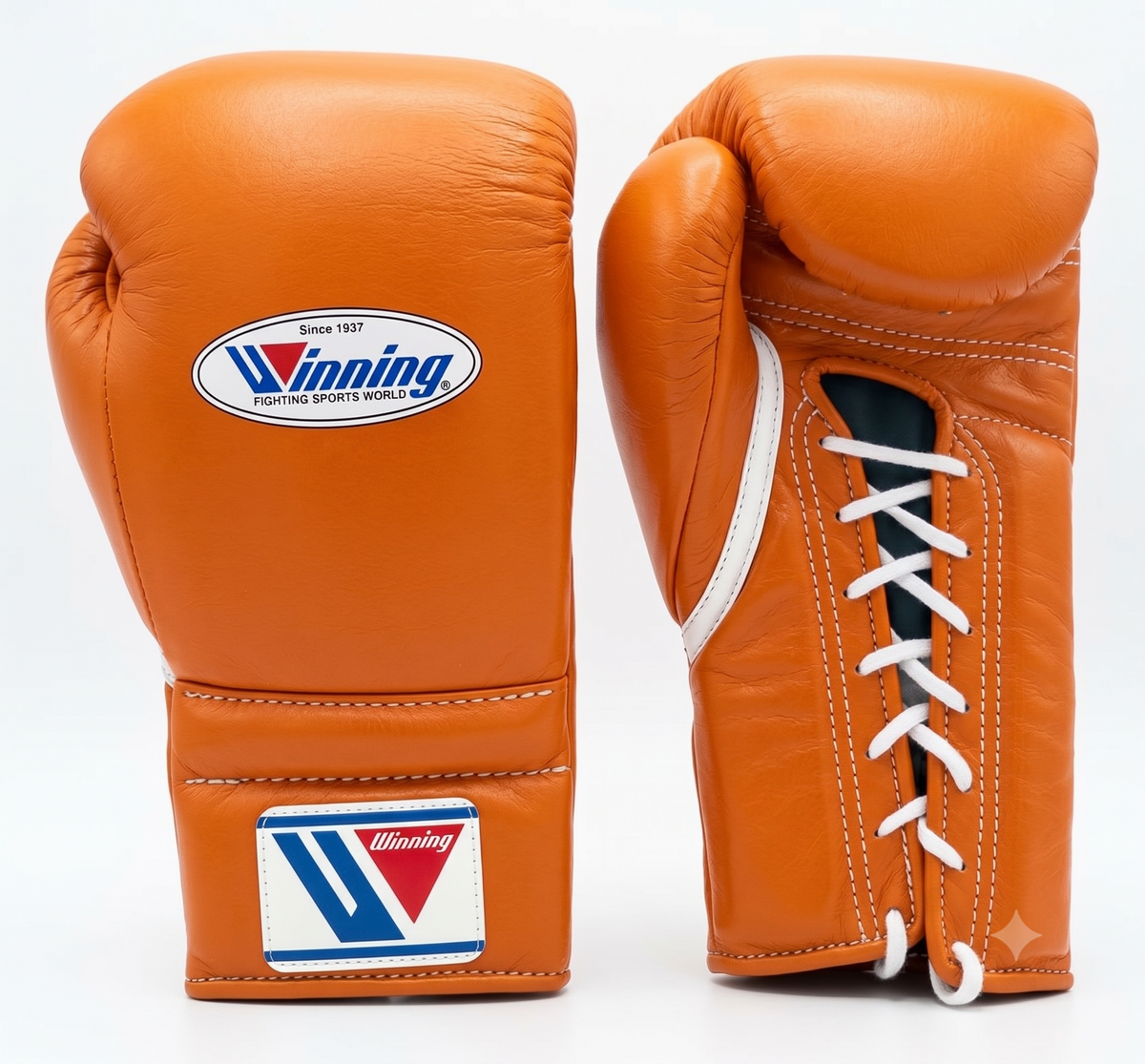 Gold and tan leather lace-up boxing training gloves from the sparring set