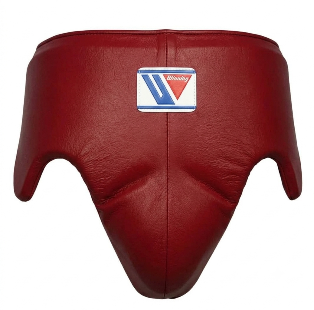 Close-up of Winning dark red leather boxing headgear showing the central brand logo patch