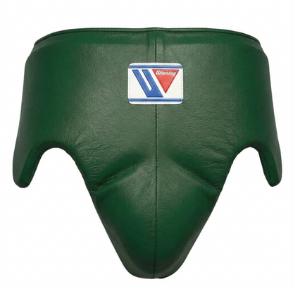 Close-up of the metallic green headgear and brand logo patch