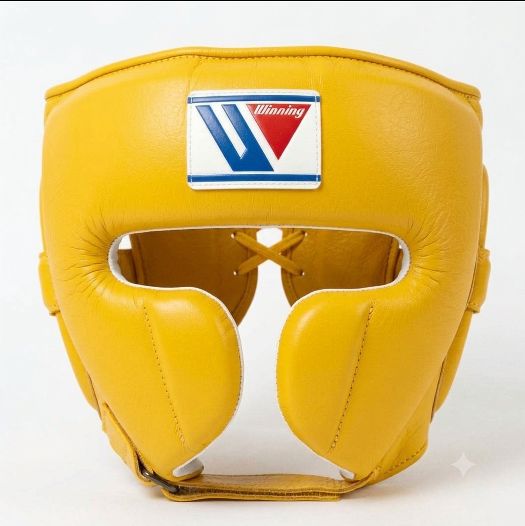 Classic yellow boxing headgear with cheek protection and logo patch