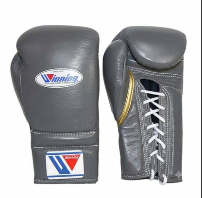 Gray leather lace-up boxing training gloves with white laces