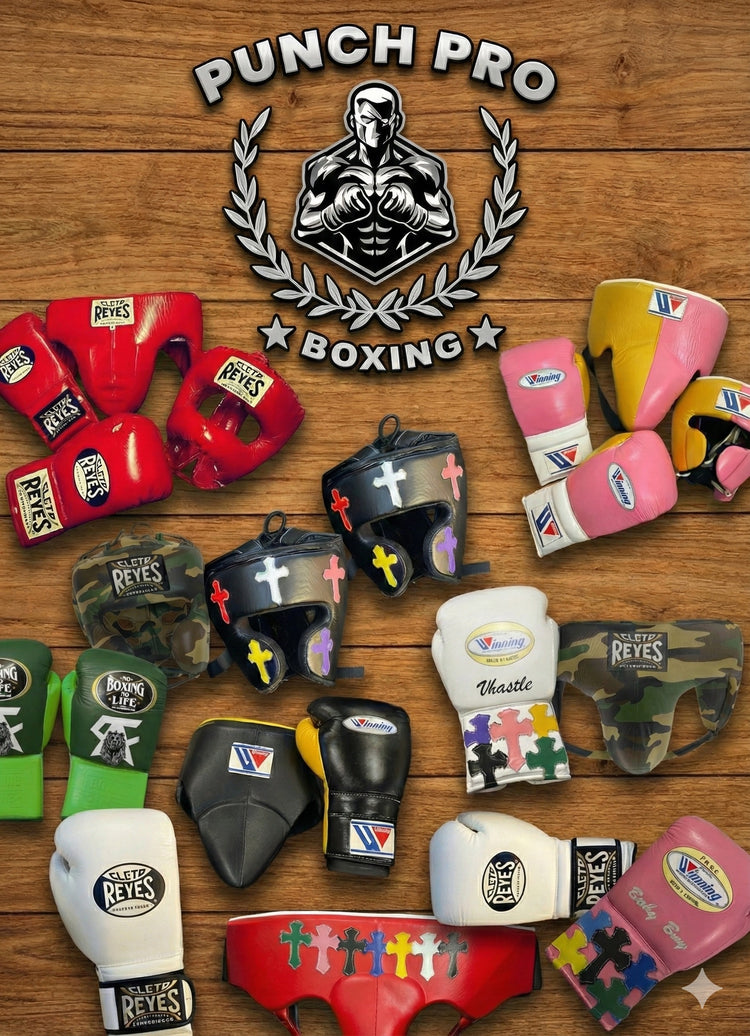 Collection of boxing gloves and headgear with Punch Pro Boxing logo on a wooden background