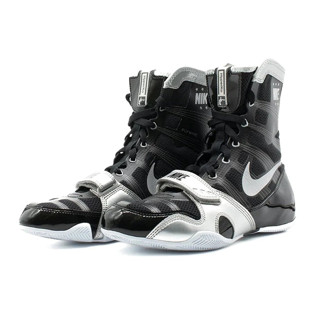A pair of Custom Nike HyperKO boxing shoes in a black and silver colorway, featuring a forefoot lockdown strap and Nike Swoosh