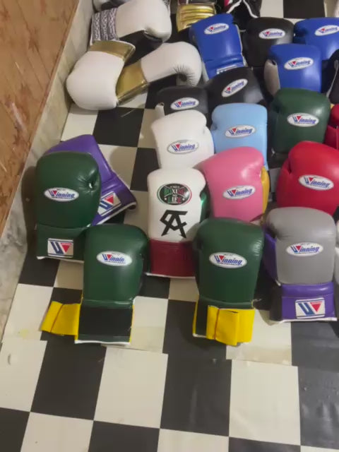Video showing custom boxing gloves, headgear and groin guards in several colourways