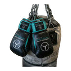 Black and teal boxing gloves side profile showing lace-up closure