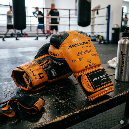 Papaya orange boxing gloves side profile showing wrist cuff