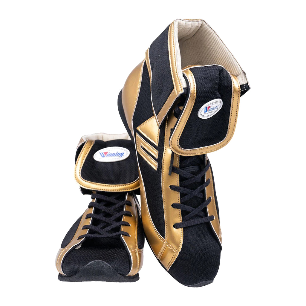 Black and gold high-top boxing shoes, lace-up front with reinforced ankle support