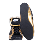 Black and gold boxing shoes showing side profile and textured rubber outsole
