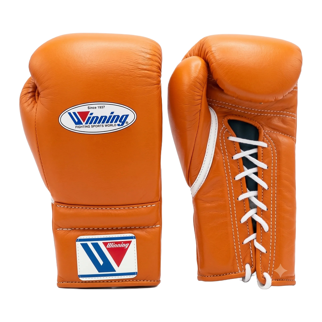 Gold and tan leather lace-up boxing training gloves from the sparring set
