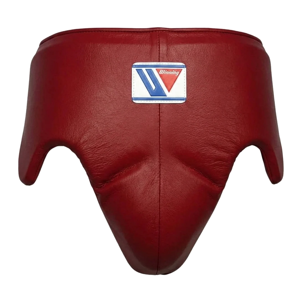 Close-up of Winning dark red leather boxing headgear showing the central brand logo patch